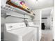 Laundry room with washer, dryer, and shelving unit at 4725 N 14Th Ave, Phoenix, AZ 85013