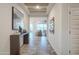 Bright and airy entryway with tile flooring and modern decor at 5010 W Capistrano Ave, Laveen, AZ 85339