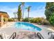 Relaxing kidney-shaped pool with patio furniture and a tranquil setting at 6721 E Jean Dr, Scottsdale, AZ 85254