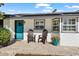 Front porch with teal door and two chairs, showing a welcoming entrance at 7247 N 6Th Pl, Phoenix, AZ 85020