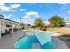 Inviting kidney shaped pool with diving board in backyard at 7247 N 6Th Pl, Phoenix, AZ 85020