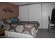 Bedroom with double bed, closet and exercise equipment at 7807 E Main St # Cc-68, Mesa, AZ 85207