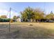 Large backyard with string lights and cornhole at 819 W Solano Dr, Phoenix, AZ 85013