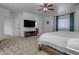 Main bedroom with TV and ensuite bathroom access at 853 E Rawhide Ct, Gilbert, AZ 85296