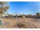 Backyard with gravel, some landscaping, and a travel trailer at 871 W Dewey Ave, Coolidge, AZ 85128