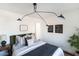 Bedroom with green velvet headboard and wood floors at 9625 N 1St St, Phoenix, AZ 85020