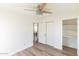 Light and airy bedroom with closet and view of living room at 9625 N 1St St, Phoenix, AZ 85020