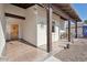 Inviting front porch with wooden columns and tile flooring at 10188 E La Palma Ave, Gold Canyon, AZ 85118