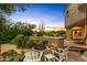 Relaxing patio with fire pit, seating, and desert landscaping at 10420 E Morning Vista Ln, Scottsdale, AZ 85262