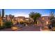 Luxury estate showcasing a grand entrance and desert landscaping at 10420 E Morning Vista Ln, Scottsdale, AZ 85262