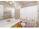 Simple bathroom with single vanity and floral shower curtain at 12738 W Hollyhock Dr, Avondale, AZ 85392