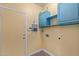 Laundry room with blue cabinets and vinyl flooring at 15251 N 153Rd Dr, Surprise, AZ 85379