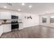 Modern kitchen with stainless steel appliances and granite countertops at 15580 S Bentley Dr, Arizona City, AZ 85123