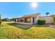 Home exterior showcasing a sunroom and grassy yard at 160 Leisure World --, Mesa, AZ 85206