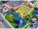 Serene pond with a fountain, landscaping, and parking at 160 Leisure World --, Mesa, AZ 85206