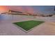 Artificial turf backyard with a block wall and gravel at 16266 W Papago St, Goodyear, AZ 85338