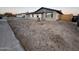 Front yard view of a single-story home with wood chips at 18229 N 20Th Pkwy, Phoenix, AZ 85023