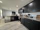 Spacious kitchen featuring dark cabinetry and granite countertops at 18229 N 20Th Pkwy, Phoenix, AZ 85023