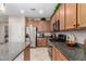 Modern kitchen with stainless steel appliances and granite countertops at 19167 W Morning Glory Dr, Buckeye, AZ 85326