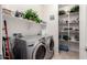 Laundry room with washer, dryer, and shelving at 19167 W Morning Glory Dr, Buckeye, AZ 85326