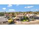 An aerial view showcasing a house, pool, and surrounding neighborhood landscape at 19436 N 36Th Pl, Phoenix, AZ 85050