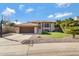 Single-story home with tile roof, attached garage, and landscaped yard at 19436 N 36Th Pl, Phoenix, AZ 85050