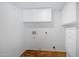 Laundry room with wooden floor and white cabinets at 19436 N 36Th Pl, Phoenix, AZ 85050