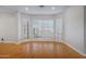 Bright living room with hardwood floors and plantation shutters at 19436 N 36Th Pl, Phoenix, AZ 85050