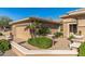 Courtyard entry with a seating area and desert landscaping at 19714 N Rim Dr, Surprise, AZ 85374