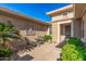 Inviting courtyard with seating area and lush greenery at 19714 N Rim Dr, Surprise, AZ 85374