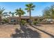 Back exterior view of a single story home with desert landscaping at 19714 N Rim Dr, Surprise, AZ 85374