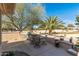 Outdoor patio with built-in grill and seating area overlooking golf course at 19714 N Rim Dr, Surprise, AZ 85374