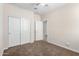 Well-lit bedroom with double door closet at 2050 E Piedmont Pl, Casa Grande, AZ 85122