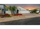 New home with a two-car garage and attractive landscaping at 2050 E Piedmont Pl, Casa Grande, AZ 85122