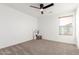 Spacious bedroom featuring a ceiling fan and large window at 23781 S 213Th St, Queen Creek, AZ 85142