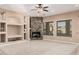 Bright living room featuring a stone fireplace and large windows at 2380 N Horseshoe Cir, Casa Grande, AZ 85122