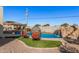 Relaxing pool with waterfall feature and comfortable seating at 2380 N Horseshoe Cir, Casa Grande, AZ 85122