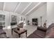 Living area featuring dark leather sofas and a wood coffee table at 2553 N Miller Rd, Scottsdale, AZ 85257