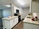 Modern kitchen with white shaker cabinets, granite countertops, and stainless steel appliances at 4222 N 48Th Ave, Phoenix, AZ 85031