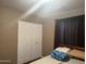 Bedroom with double doors and window with blinds at 4317 E Friess Dr, Phoenix, AZ 85032