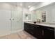 Elegant bathroom with double vanity, large shower, and modern fixtures at 4779 N 205Th Gln, Buckeye, AZ 85396