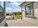 Inviting front patio with brick pavers, landscaping, and a cactus at 4779 N 205Th Gln, Buckeye, AZ 85396