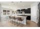 Open concept kitchen with island, stainless steel appliances, and breakfast bar at 4779 N 205Th Gln, Buckeye, AZ 85396
