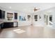 Spacious living room with hardwood floors and ceiling fan at 4779 N 205Th Gln, Buckeye, AZ 85396