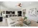 Open concept living room with a view into the kitchen at 4779 N 205Th Gln, Buckeye, AZ 85396