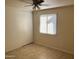 Bedroom with tile floors and sliding door closet at 5220 W Cambridge Ave, Phoenix, AZ 85035