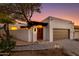 Private gated entry to a beautiful stucco home with a wooden door at 5800 N Echo Canyon Ln, Phoenix, AZ 85018