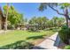 Landscaped courtyard with walking path and lush greenery at 7009 E Acoma Dr # 1143, Scottsdale, AZ 85254