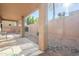 Covered patio with stone and gravel landscaping, perfect for outdoor entertaining at 7019 S Golfside Ln, Phoenix, AZ 85042