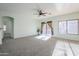 Living room with sliding glass doors and neutral carpet at 7019 S Golfside Ln, Phoenix, AZ 85042